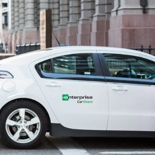 The back of a white Enterprise CarShare vehicle