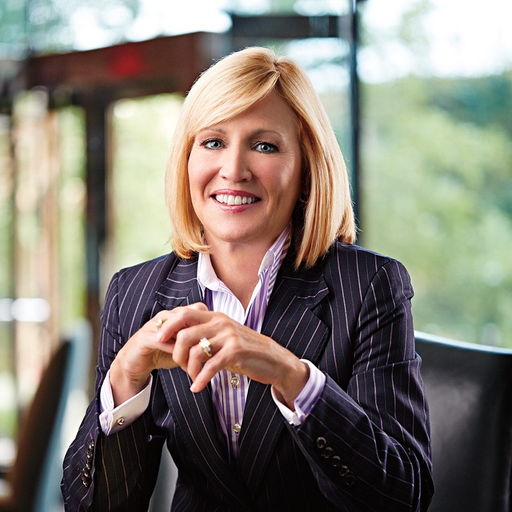 Pam Nicholson sitting at her office desk