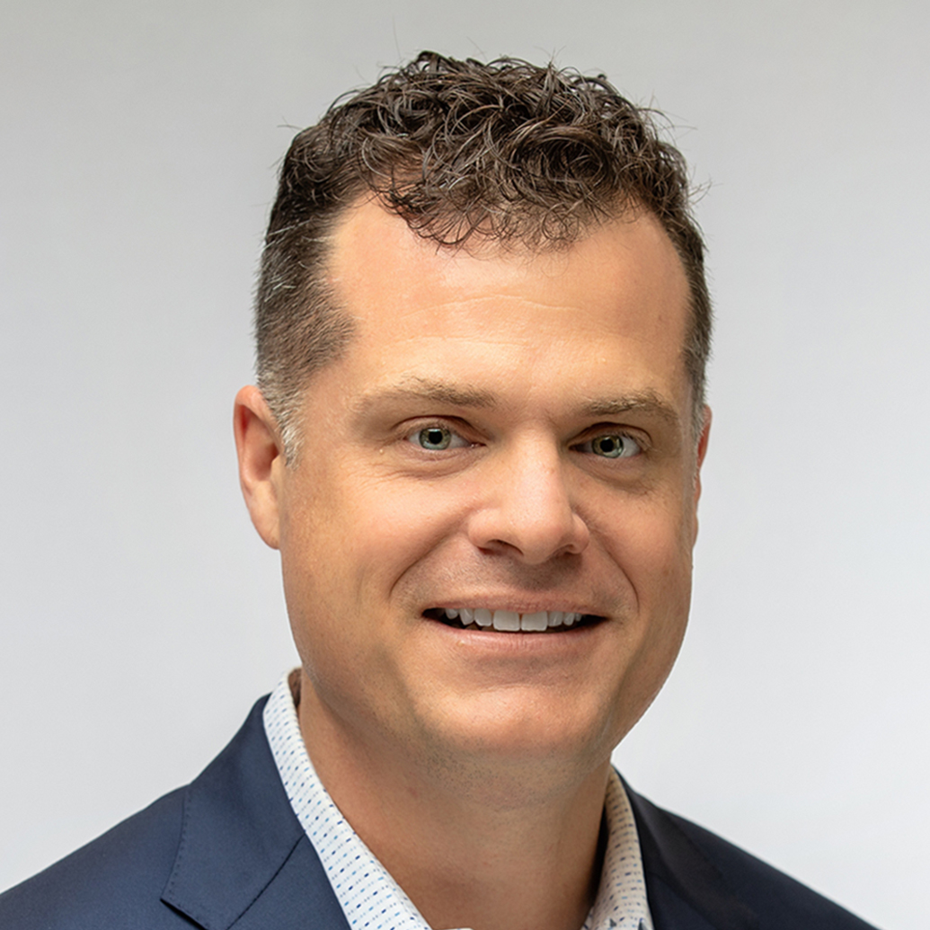 Bryan Taylor headshot on a light gray background