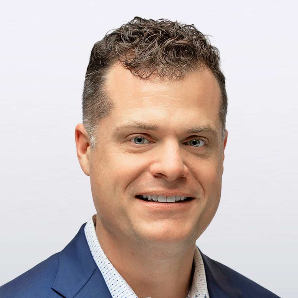 Bryan Taylor headshot on a light gray background