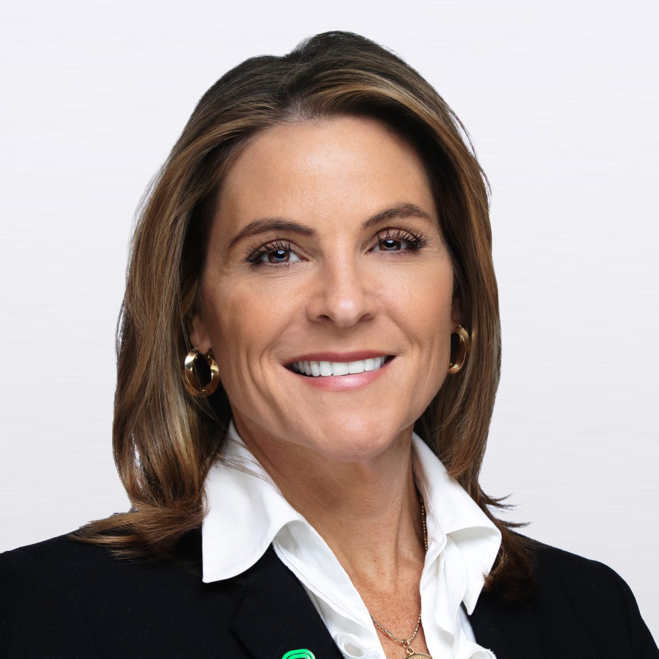 Margi Dolan headshot on a light gray background