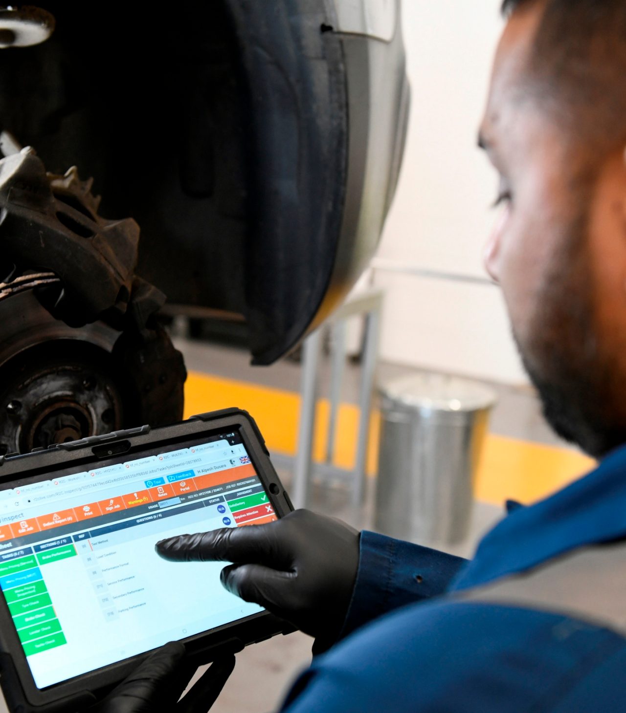 A main looks at an iPad in a shop