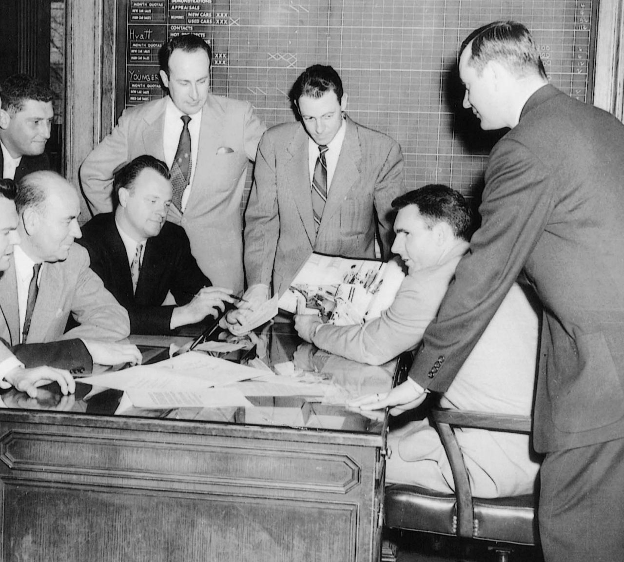 Founder Jack Taylor leads a meeting with a group in 1957