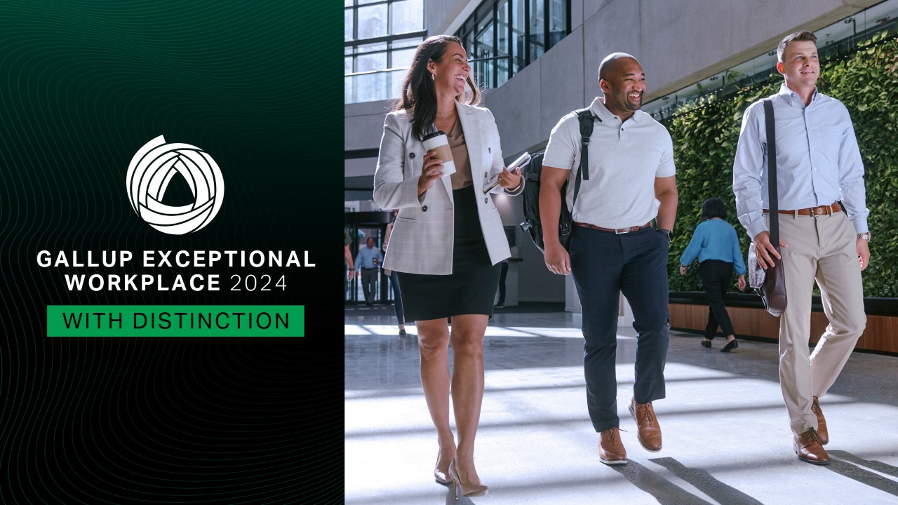 Gallup Exceptional Workplace graphic with two male employees and one female employee walking through an office building lobby.