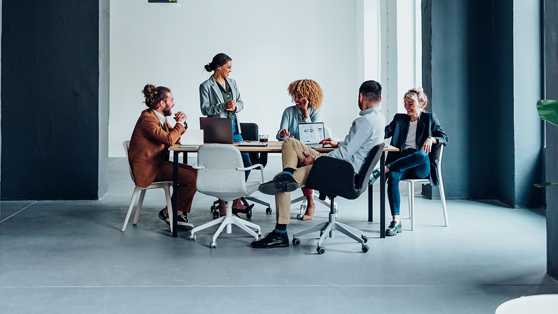 Several people meet in a conference room.