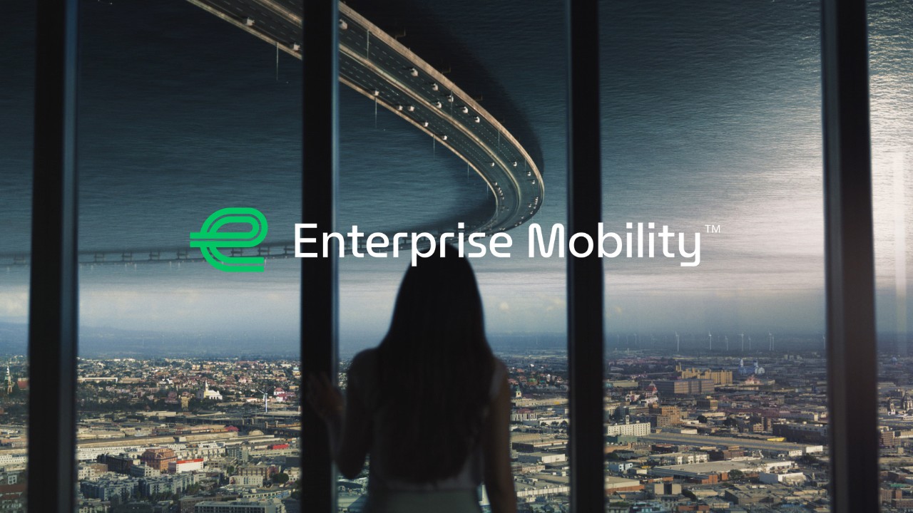 Enterprise Mobility logo on top of city scene at night